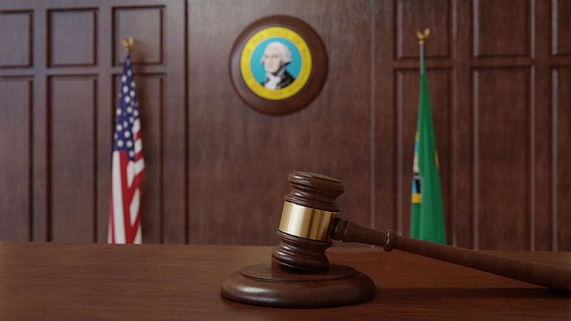 Courtroom scene with US flag and state seal and flag of the state of Washington. 3d rendering