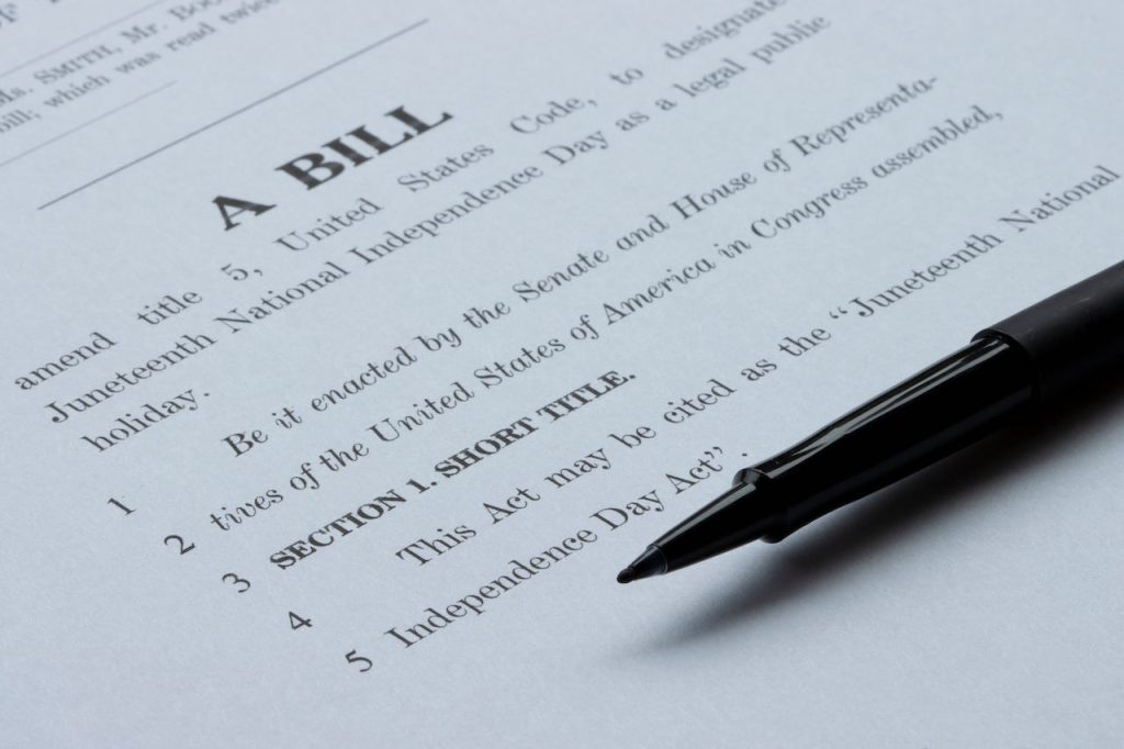 us poker gambling bill document with a pen on it