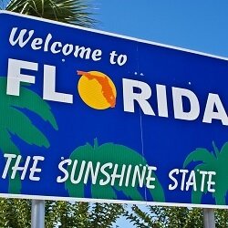A sign welcoming visitors to Florida, the Sunshine State.