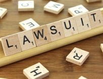 The word "Lawsuit" spelled out in scrabble letters.