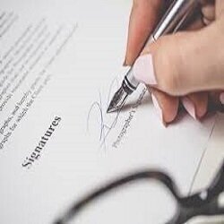 Ambassador signings contracts