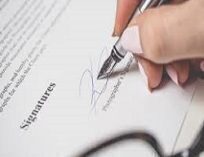Ambassador signings contracts