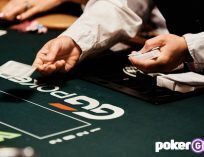 WSOP Dealer dealing cards at the poker table