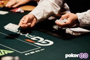 WSOP Dealer dealing cards at the poker table