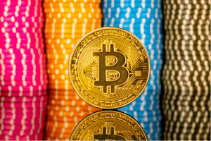 Bitcoin in front of a pile of poker chips