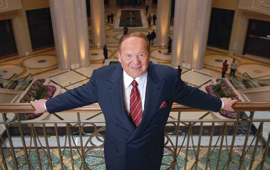 Sheldon Adelson with his arms wide