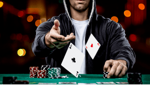 poker player throwing cards in the middle of the table