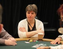 Victoria Livschitz with a coffee at a poker table