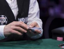 WSOP Dealer with Cards