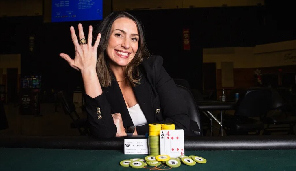 Danielle Moran holds up first WSOPC ring to the camera proudly at Turning Stone Resort Casino.