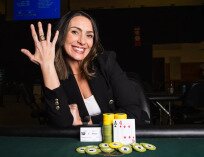 Danielle Moran holds up first WSOPC ring to the camera proudly at Turning Stone Resort Casino.