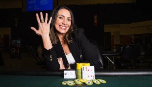 Danielle Moran holds up first WSOPC ring to the camera proudly at Turning Stone Resort Casino.