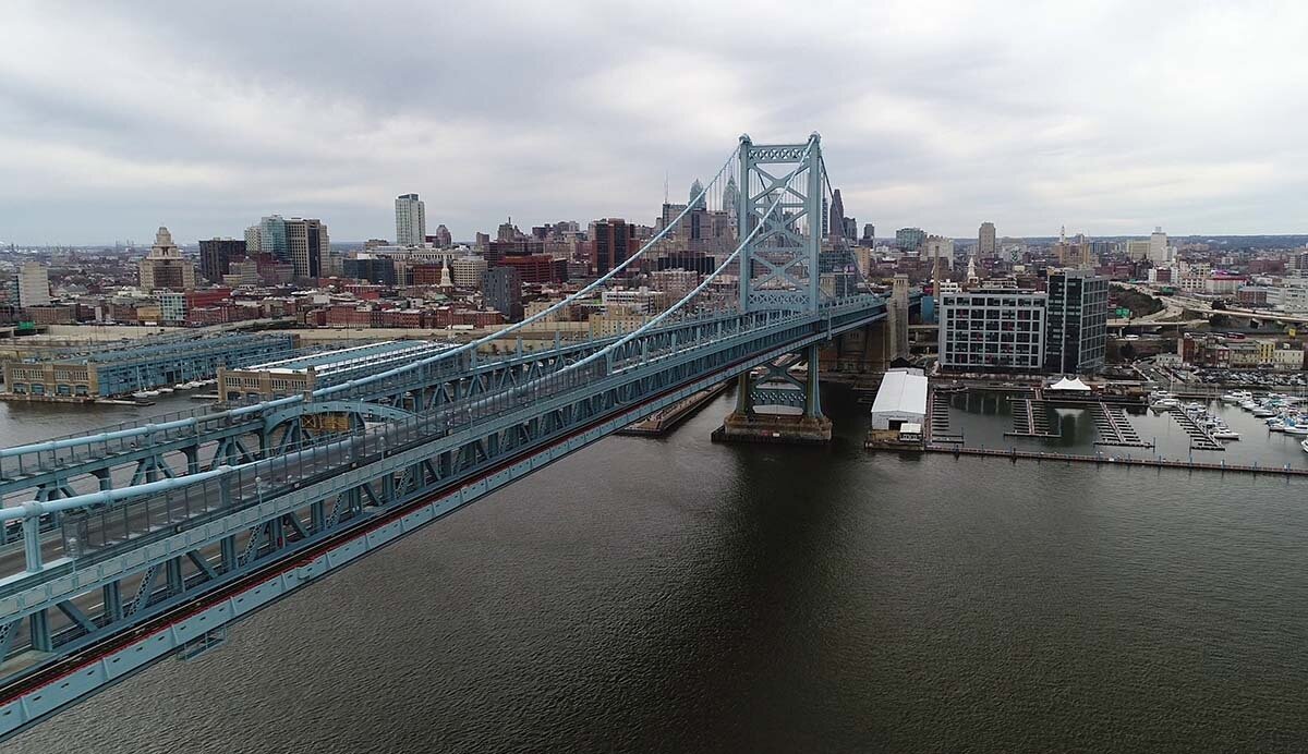 Aerial view of the Benjamin Franklin Bridge framed by the Philadelphia, Pennsylvania skyline.