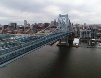 Aerial view of the Benjamin Franklin Bridge framed by the Philadelphia, Pennsylvania skyline.