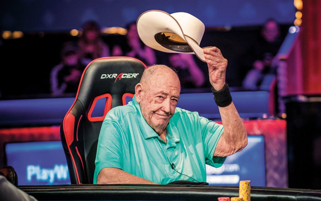 Doyle Brunson taking his hat off at poker table