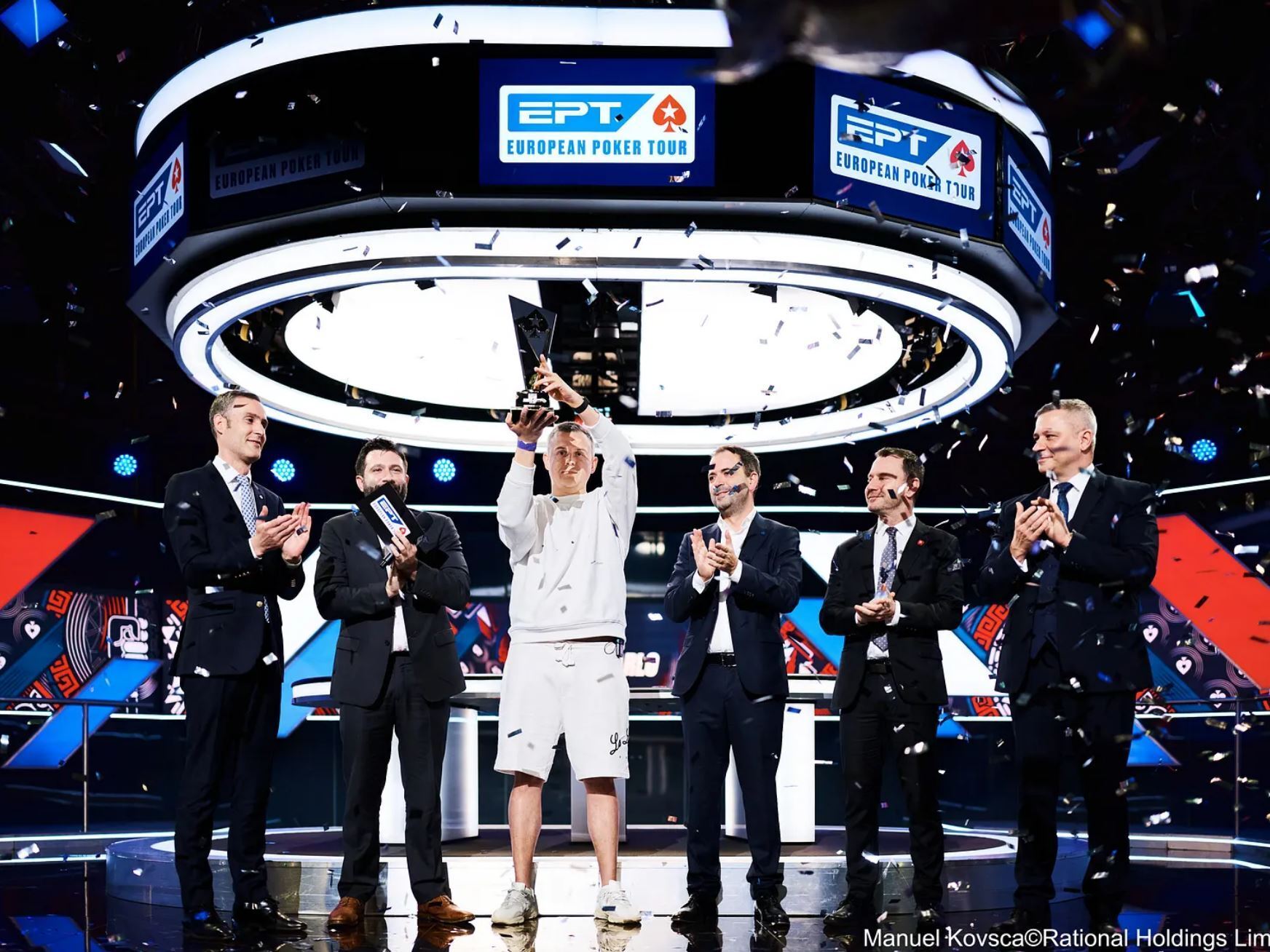 Sheliakov holds trophy for his EPT Monte Carlo 1.07M win.