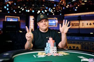 Shaun Deeb With his Winning poker chips and hand