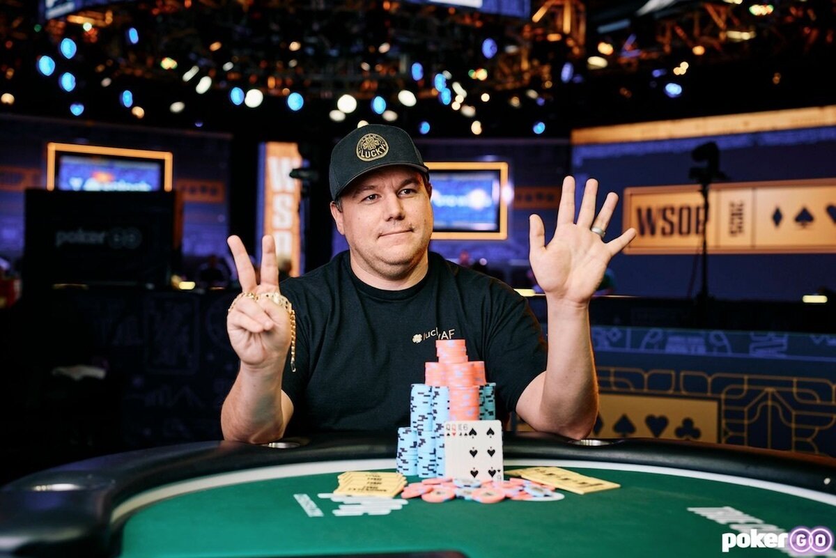 Shaun Deeb With his Winning poker chips and hand