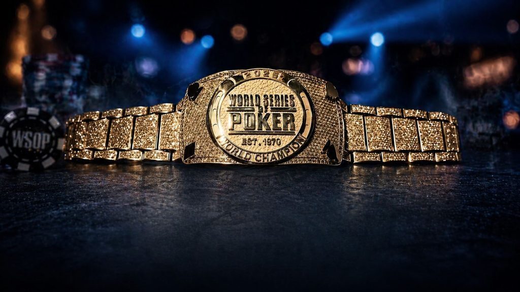 WSOP Main Event winners bracelet on a poker table with chips and casino lighting
