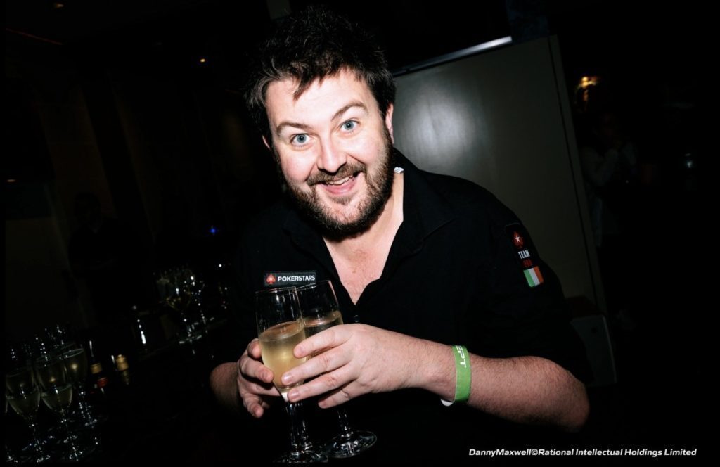 Poker player David Lappin holding champagne glasses at the EPT Monte Carlo player party.