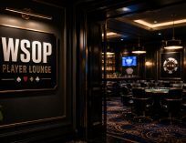 Entrance to a WSOP Player Lounge with a gold-accented wall sign, opening into a dimly lit poker room with tables, chairs, and upscale casino decor