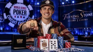 Kyle Grupp celebrates his 2026 WSOP Circuit Turning Stone Main Event victory, with poker chips, playing cards and WSOP Circuit branding in the background.